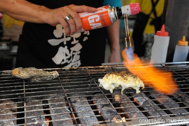 Best Thing I Ever Ate by Sometimes Home travel blog. Photos of a macaroni and cheese baked oyster in Miyajima Island, Japan.