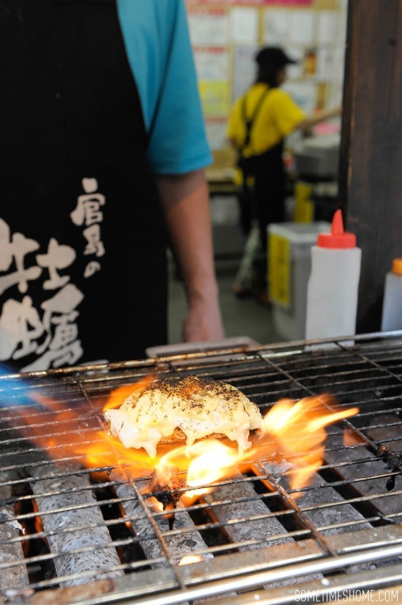 Best Thing I Ever Ate by Sometimes Home travel blog. Photos of a macaroni and cheese baked oyster in Miyajima Island, Japan.