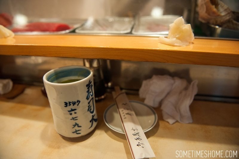 Sushi Dai Restaurant at Tsukiji Fish Market in Tokyo Japan. Photos on Sometimes Home travel blog with the green tea offering.