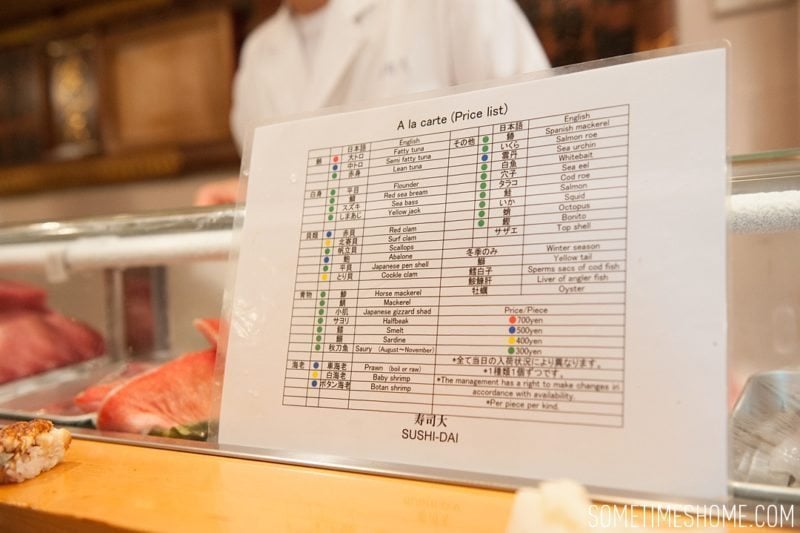 Sushi Dai Restaurant at Tsukiji Fish Market in Tokyo Japan. Photos on Sometimes Home travel blog with the menu of options in English.