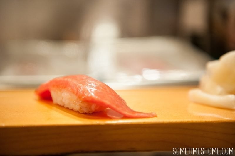 Sushi Dai Restaurant at Tsukiji Fish Market in Tokyo Japan. Photos on Sometimes Home travel blog with a photo of the fatty tuna/toro.