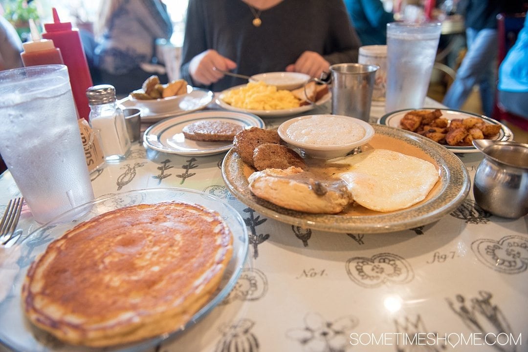 What to do on a rainy day in Boone, NC. Photos and activities on Sometimes Home travel blog. Picture of a hearty breakfast from Melanie's Food Fantasy, including grits and pancakes.