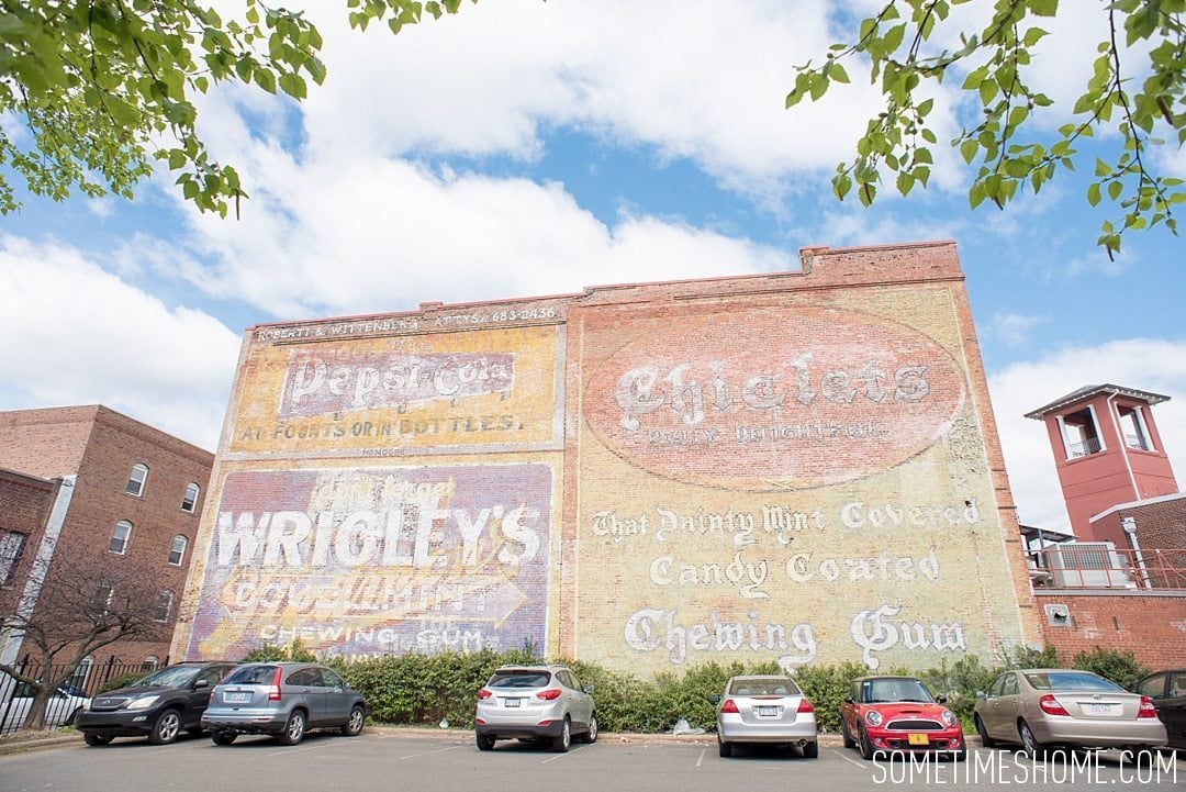 Incredible Downtown Durham Staycation Schedule. Sometimes Home travel advice. Photo of a vintage wall in the downtown area.