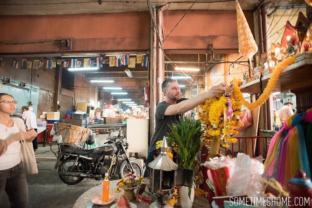 Fascinating Bangkok Place to Visit: Bangrok Tour, East Meets West by Sometimes Home travel blog. Photo of a flower offering to the gods.