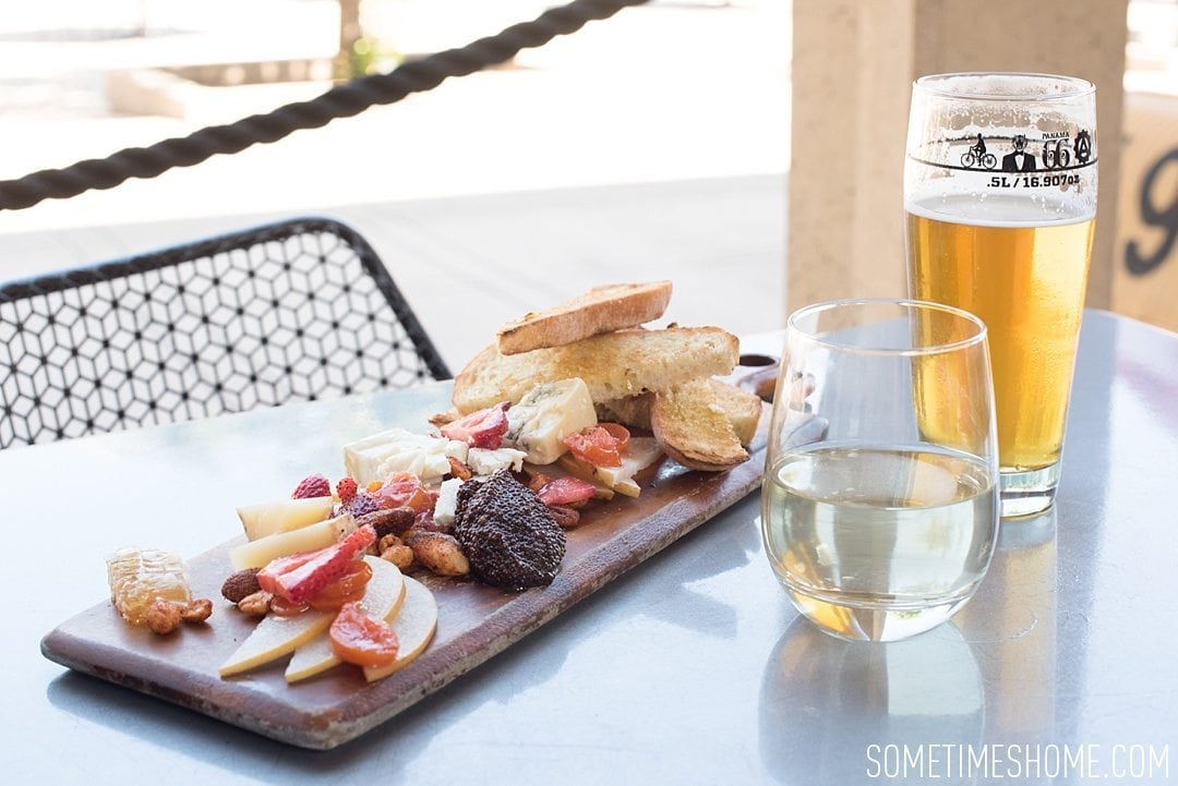 My 12 Favorite Spots Around San Diego California. Photos including Balboa Park restaurant Panama 66 cheese plate, beer and wine.