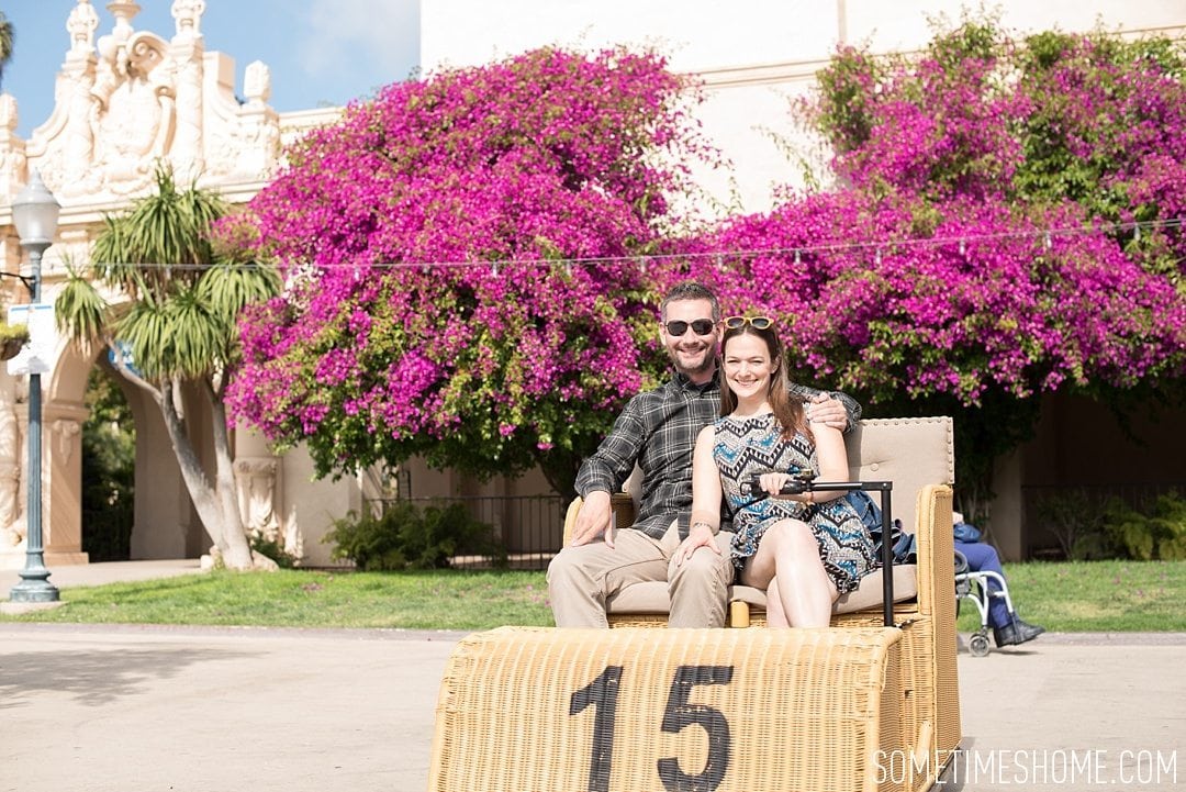 My 12 Favorite Spots Around San Diego California. Photograph of pink bougainvillea and electric wicker carts at Balboa Park.