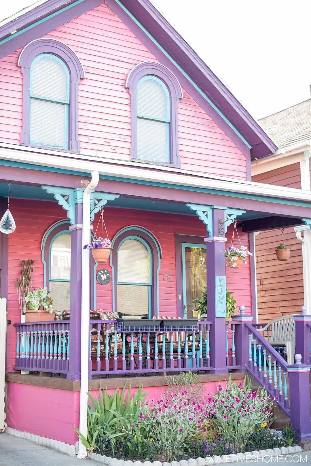 Why a Trip to Buffalo Had Me in Disbelief on Sometimes Home travel blog. Photo of a pink, blue and purple house in the city's downtown area of Allentown.