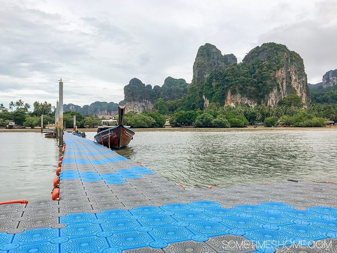 Phuket Thailand Private Rock Climbing Trip to Railay Beach photos with Gecko Thailand on Sometimes Home travel blog. Picture of the aqua colored ocean water and traditional long tail boats.