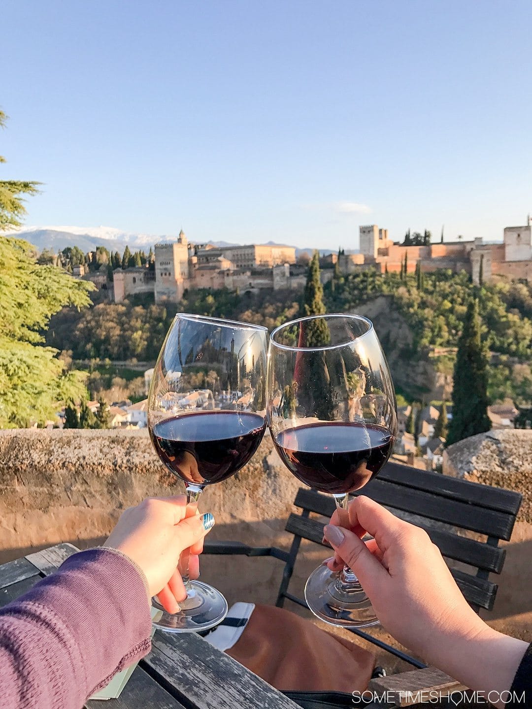 One Perfect Day in Granada Spain. Photos and itinerary on Sometimes Home travel blog. Picture of the view of the Alhambra from El Huerto de Juan Ranas.