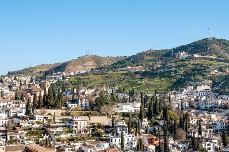 One Perfect Day in Granada Spain. Photos and itinerary on Sometimes Home travel blog. Overall semi aerial photo of the city from the Alhambra's fort.