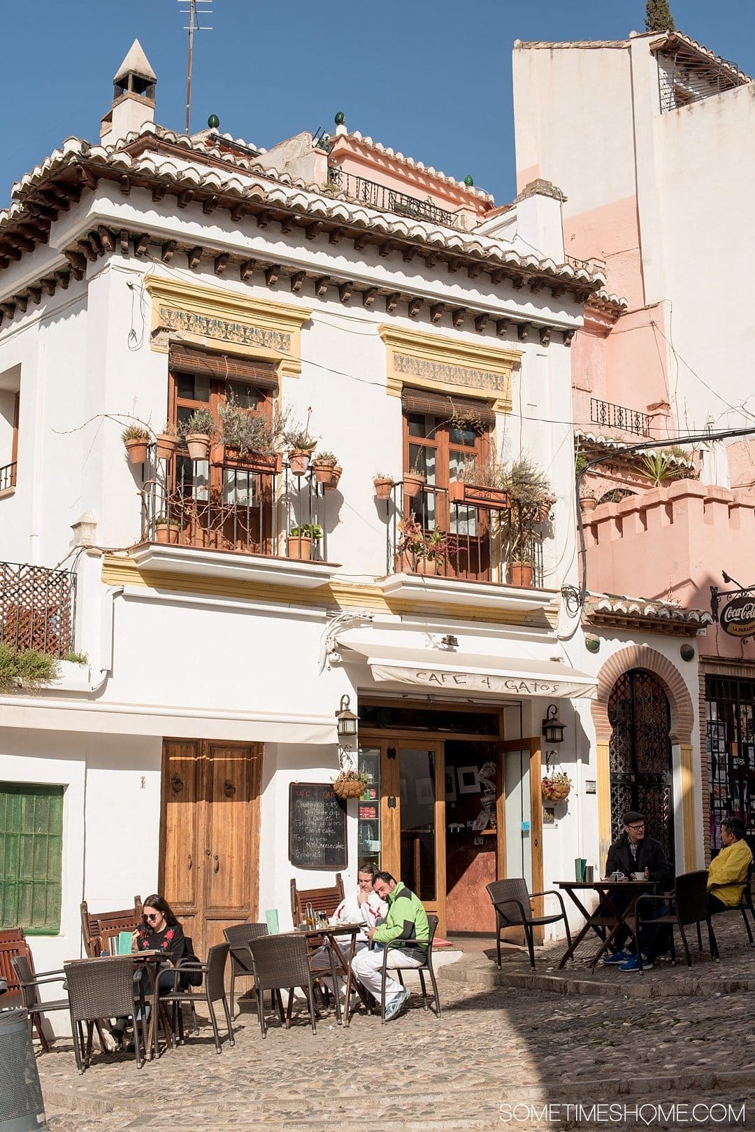 One Perfect Day in Granada Spain. Photos and itinerary on Sometimes Home travel blog. Picture of Cafe Gatos, where you can see the Alhambra.