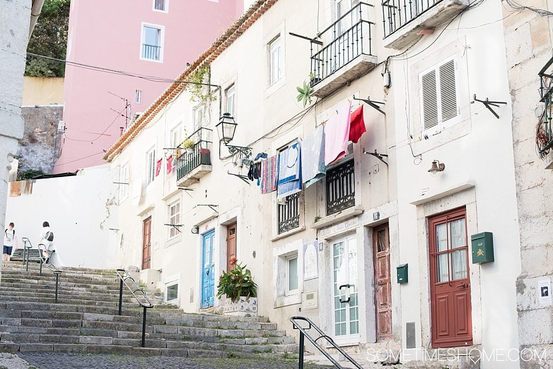 Why Lisbon is the Best City in Europe on Sometimes Home travel blog. Photo of a typical staircase alley in the city.