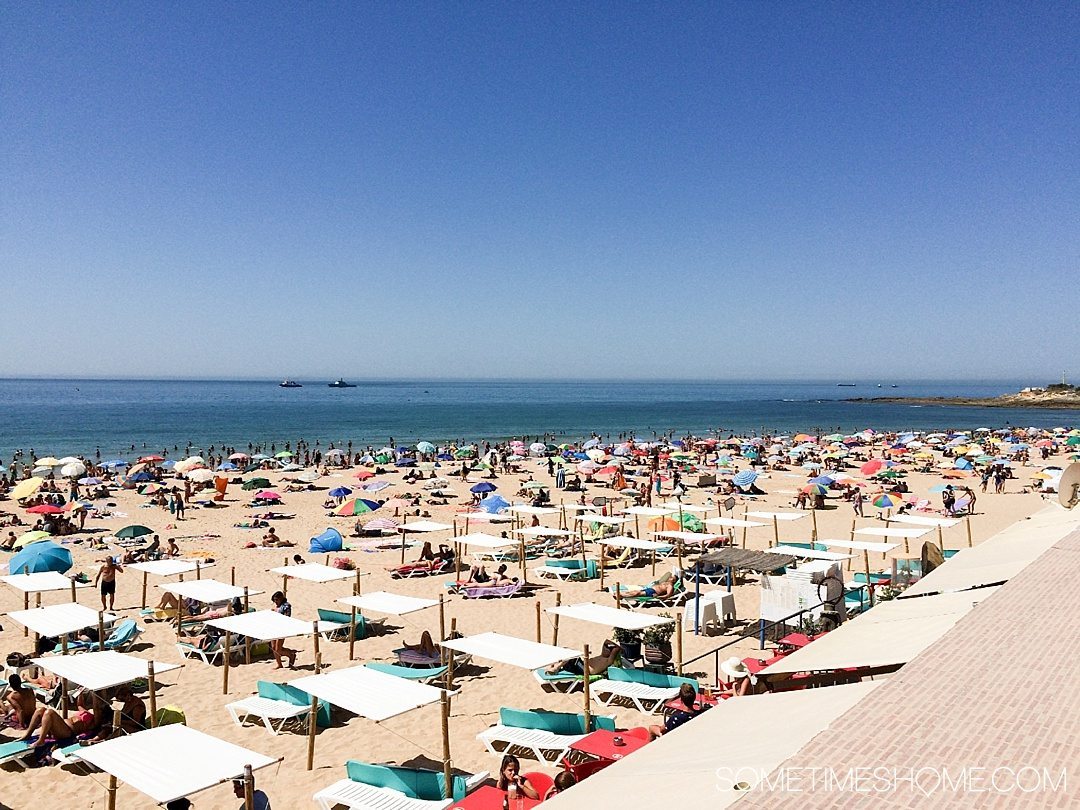 Why Lisbon is the Best City in Europe on Sometimes Home travel blog. Photo of Cascais Beach.