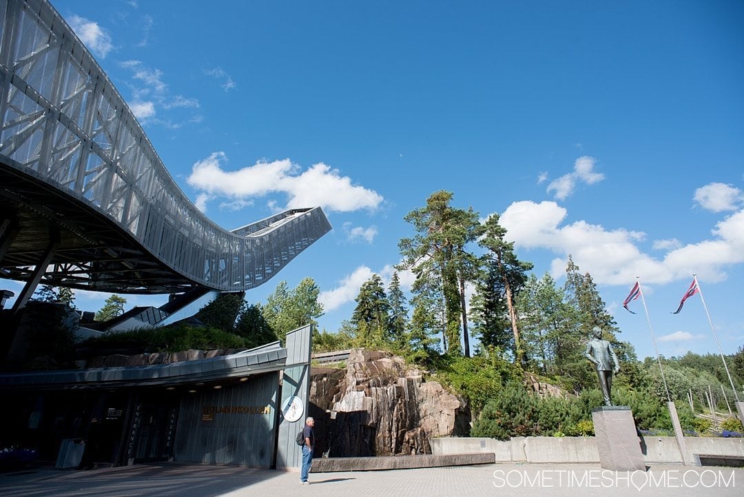 10 Not-to-Miss Sites in Oslo Norway by Sometimes Home travel blog. View of Holmenkollen ski jump during summer.