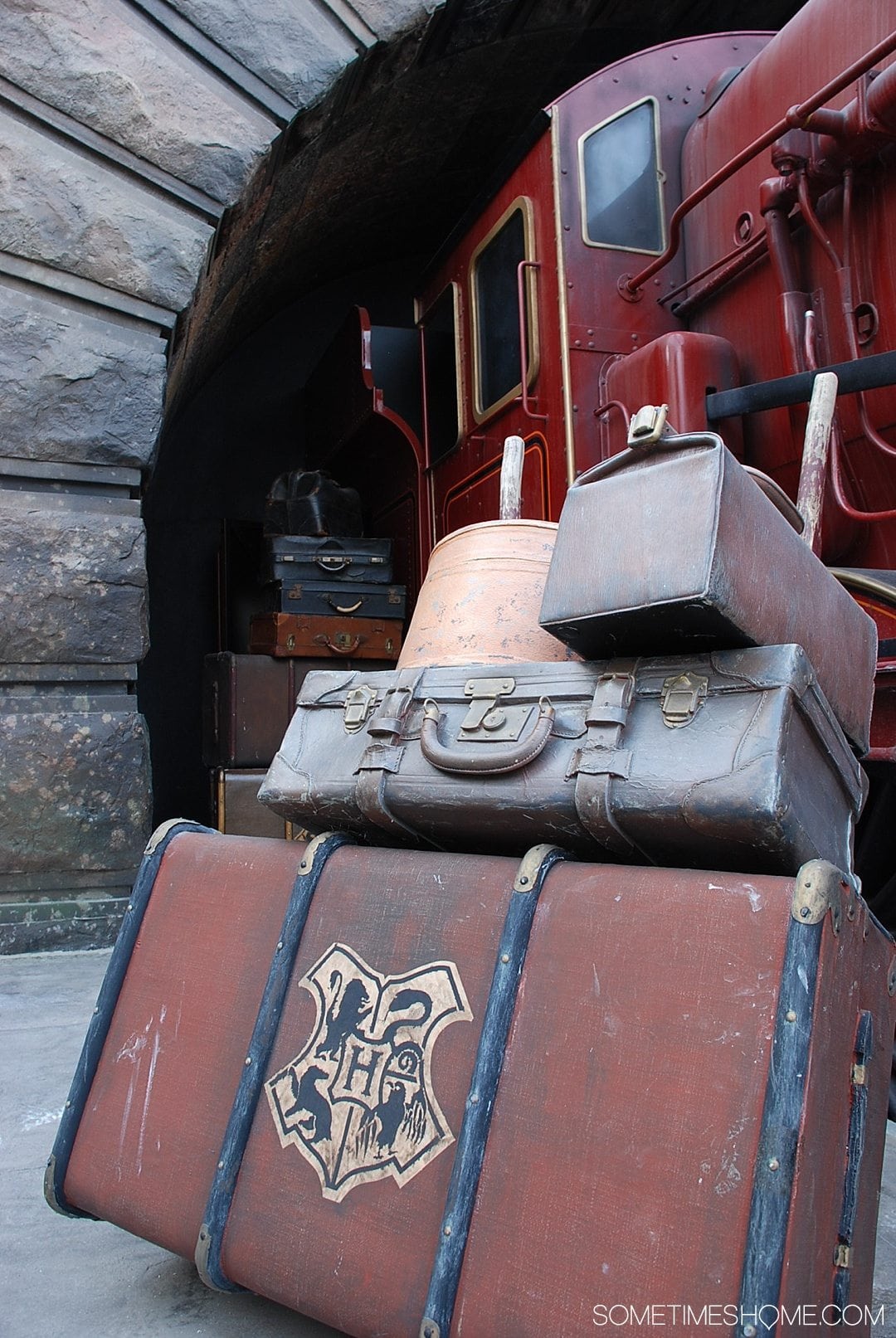 5 Mistakes to Avoid at the Wizarding World of Harry Potter in Orlando, Florida by Sometimes Home travel blog. Photo of Hogwarts Express luggage.