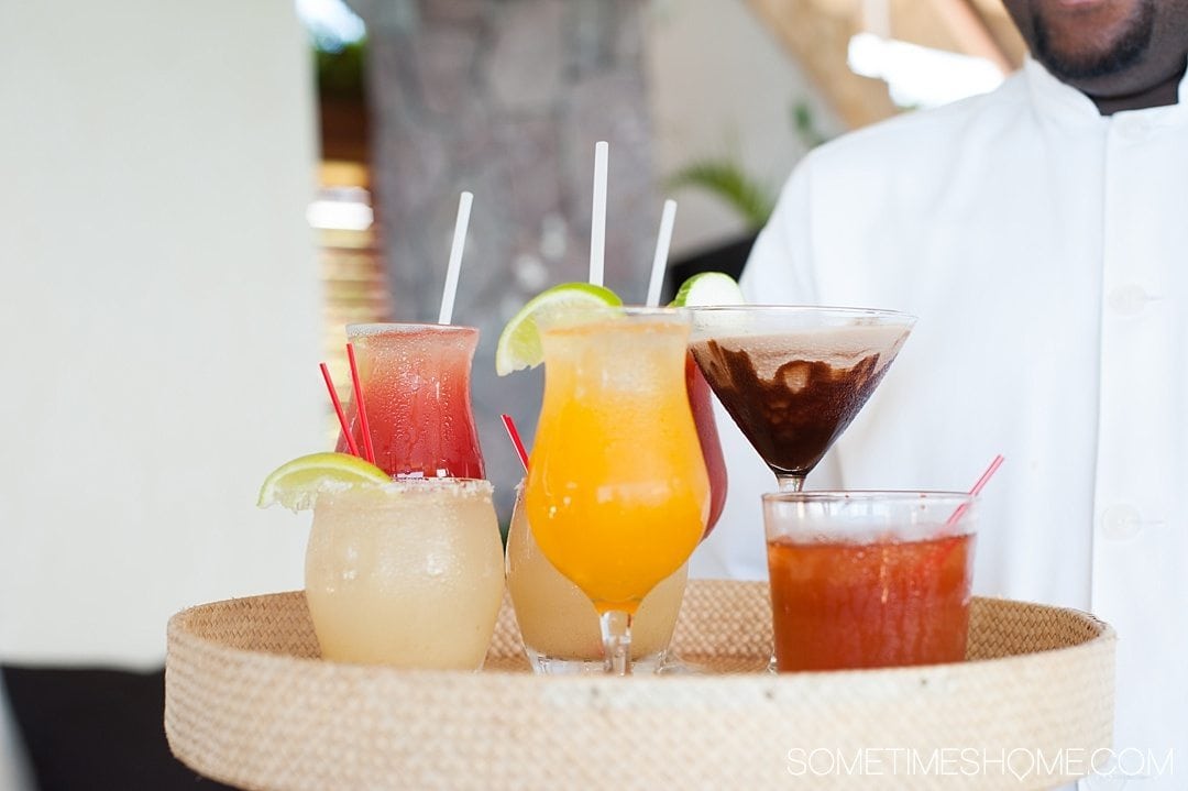 Your Questions Answered: Jade Mountain St. Lucia on Sometimes Home travel blog. Photo of cocktails at Jade Mountain Club. 