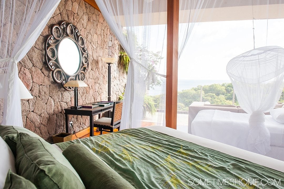 Your Questions Answered: Jade Mountain St. Lucia on Sometimes Home travel blog. Photo of netting around the bed in the Galaxy sanctuary suite.