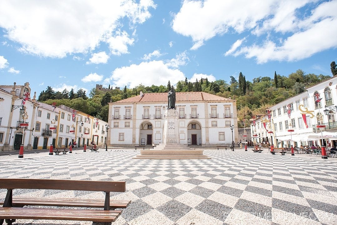 Amazing Day Trip from Lisbon to Tomar Portugal. Photos, tips and advice on Sometimes Home travel blog. Picture of Praca de Republica black and white checkerboard square.