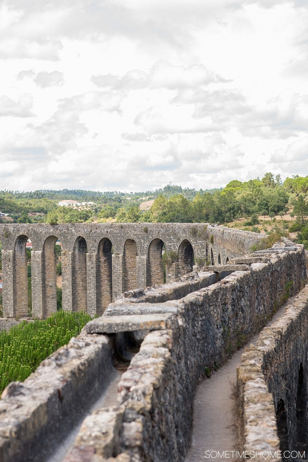 Amazing Day Trip from Lisbon to Tomar Portugal. Photos, tips and advice on Sometimes Home travel blog. Picture of Pegoes Aqueduct.