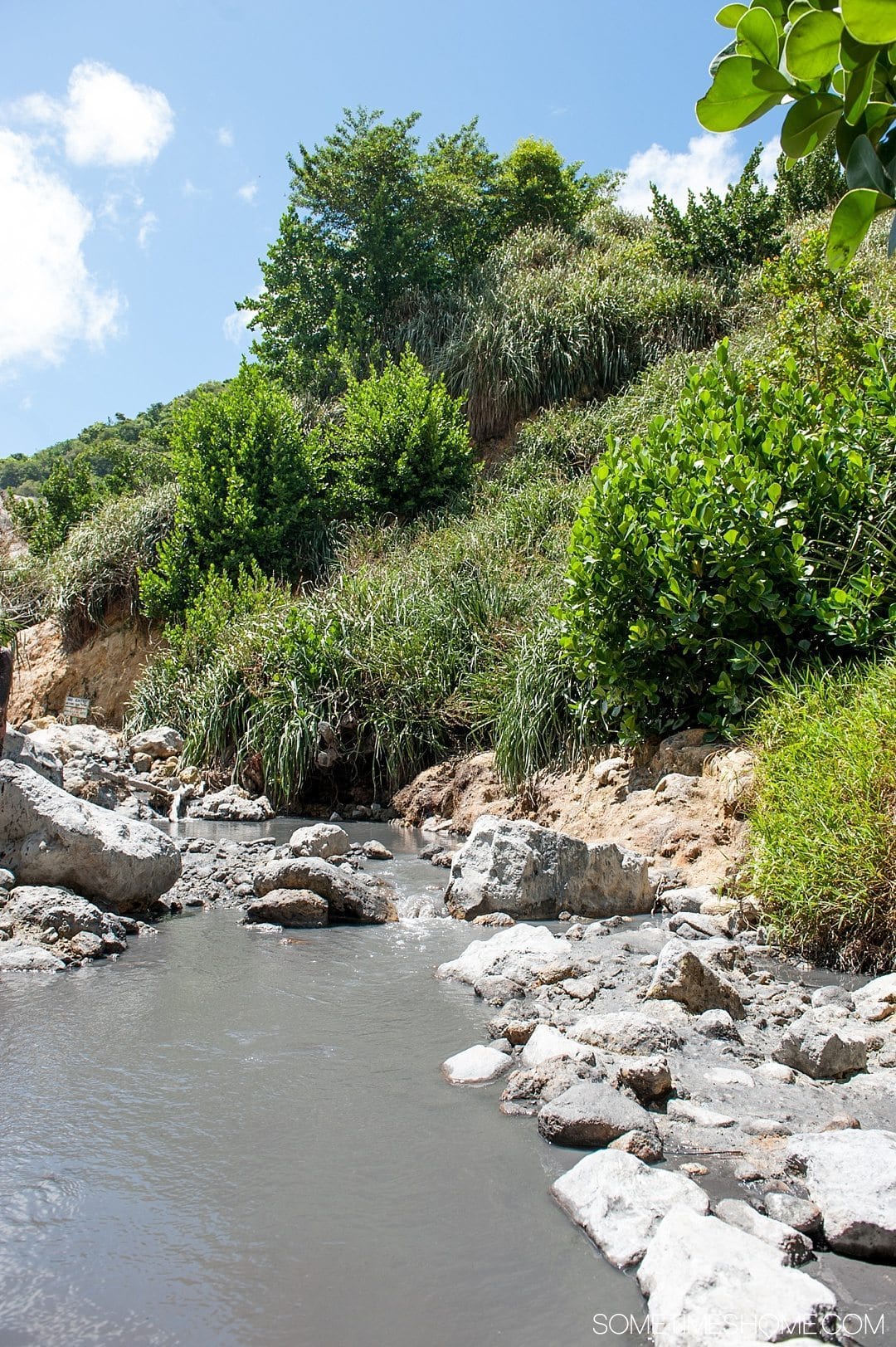 Must Do Activities to Revel In on Vacation in St. Lucia on Sometimes Home travel blog. Photos of Sulphur Springs volcano and mud baths.