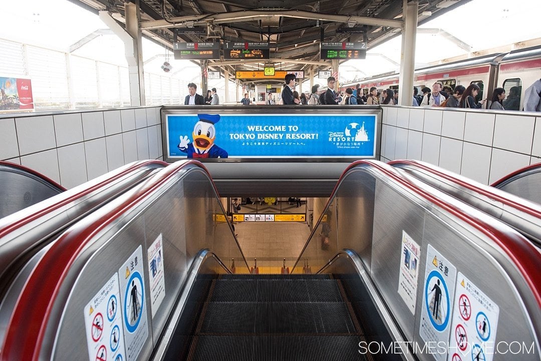 The Ultimate First-Timer's Guide to Tokyo DisneySea on Sometimes Home travel blog. Photo of Disney signage at the JR Maihama line station. 