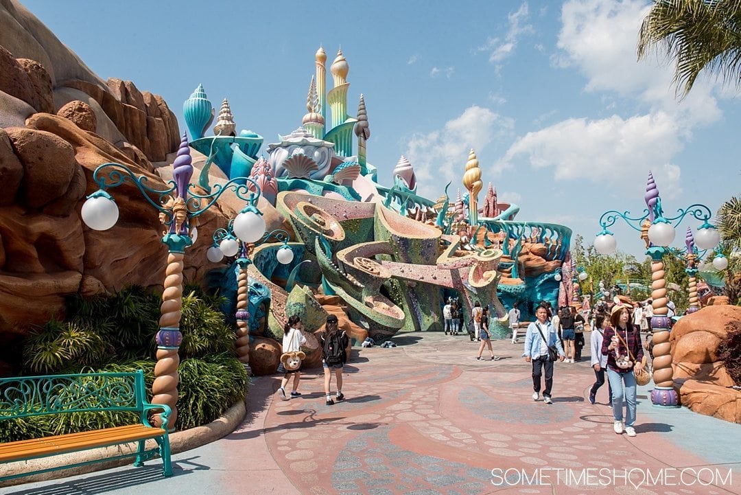 The Ultimate First-Timer's Guide to Tokyo DisneySea on Sometimes Home travel blog. Photo of the pastel mosaic entrance to Mermaid Lagoon.