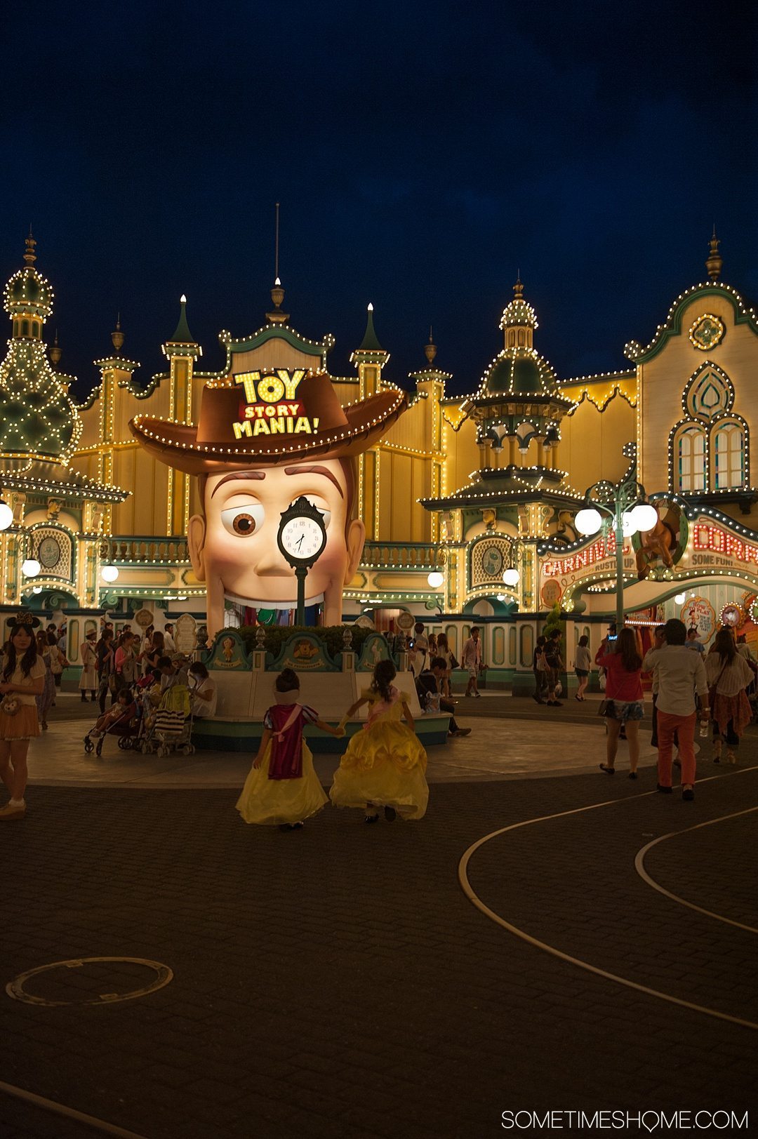 The Ultimate First-Timer's Guide to Tokyo DisneySea on Sometimes Home travel blog. Photo of the Toy Story area in American Waterfront illuminated at night.