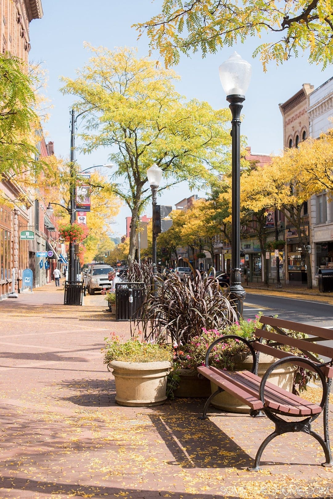 Things to do in Corning NY in the Finger Lakes region on Sometimes Home travel blog. Photo of the downtown area on W. Market Street.