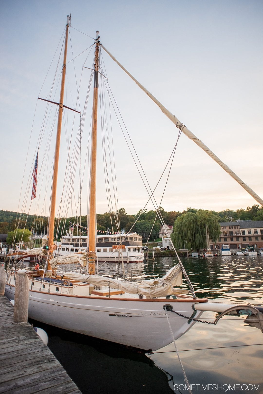 Romantic places in New York State with a weekend trip to Watkins Glen. Take a road trip from NYC to this Finger Lakes destination and take a sailboat ride on a beautiful lake aboard "True Love." Click through to see exactly what activities make it so romantic! #FingerLakesVacations #RomanticGetawayAdvenutres