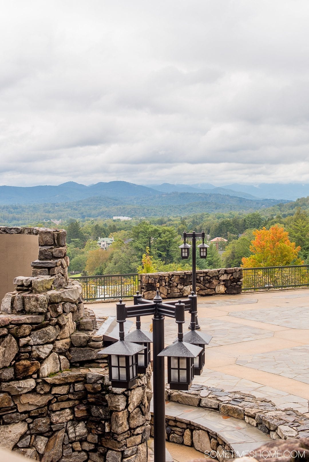 Where to find beer and art in Asheville North Carolina. Photos and locations on Sometimes Home travel blog, including Omni Grove Park Inn's Edison bar with a bee inspired cocktail and beautiful view of the Blue Ridge Mountains.