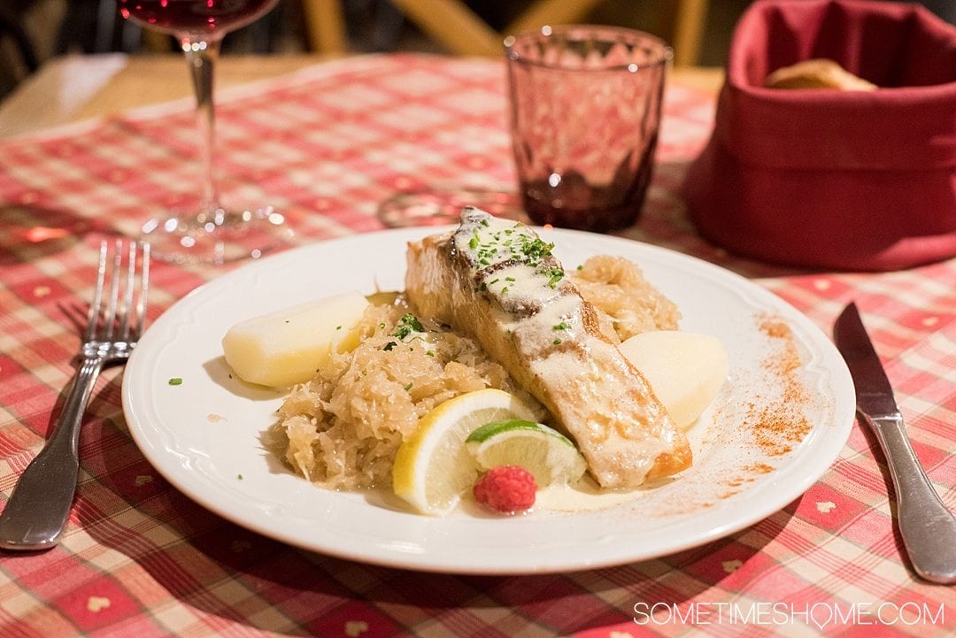 Foods you need to try in the Alsace region of France, including Colmar. Everything from wine to entrees and all the comfort foods you can handle! Especially their famous Choucroute Alsacienne! Click through to see photos of these amazing delights and gain more insight into the culture of the area through food! #AlsaceFrance #ColmarFrance #AlsaceFood
