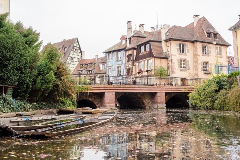 Tips and tricks to know visiting Colmar France with travel information and beautiful photography of this fairy tale village, particularly known for its Christmas markets during winter, in the Alsace region by Germany. #ColmarFrance #fairytalecity #AlsaceFrance