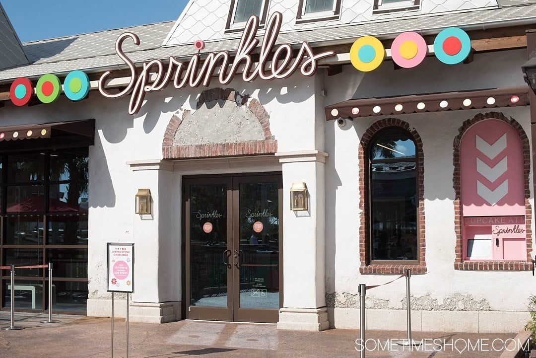Heading to Walt Disney World? Definitely travel to Disney Springs (formally known as Downtown Disney) for a trip and indulgence in food! We dish on ideas for the best Disney Springs desserts (like a famous treat from Sprinkles and their cupcake ATM) with photography at this Orlando, Florida themed area. Click through to Sometimes Home for detailed tips! #DisneySprings #WaltDisneyWorld #DisneyWorld
