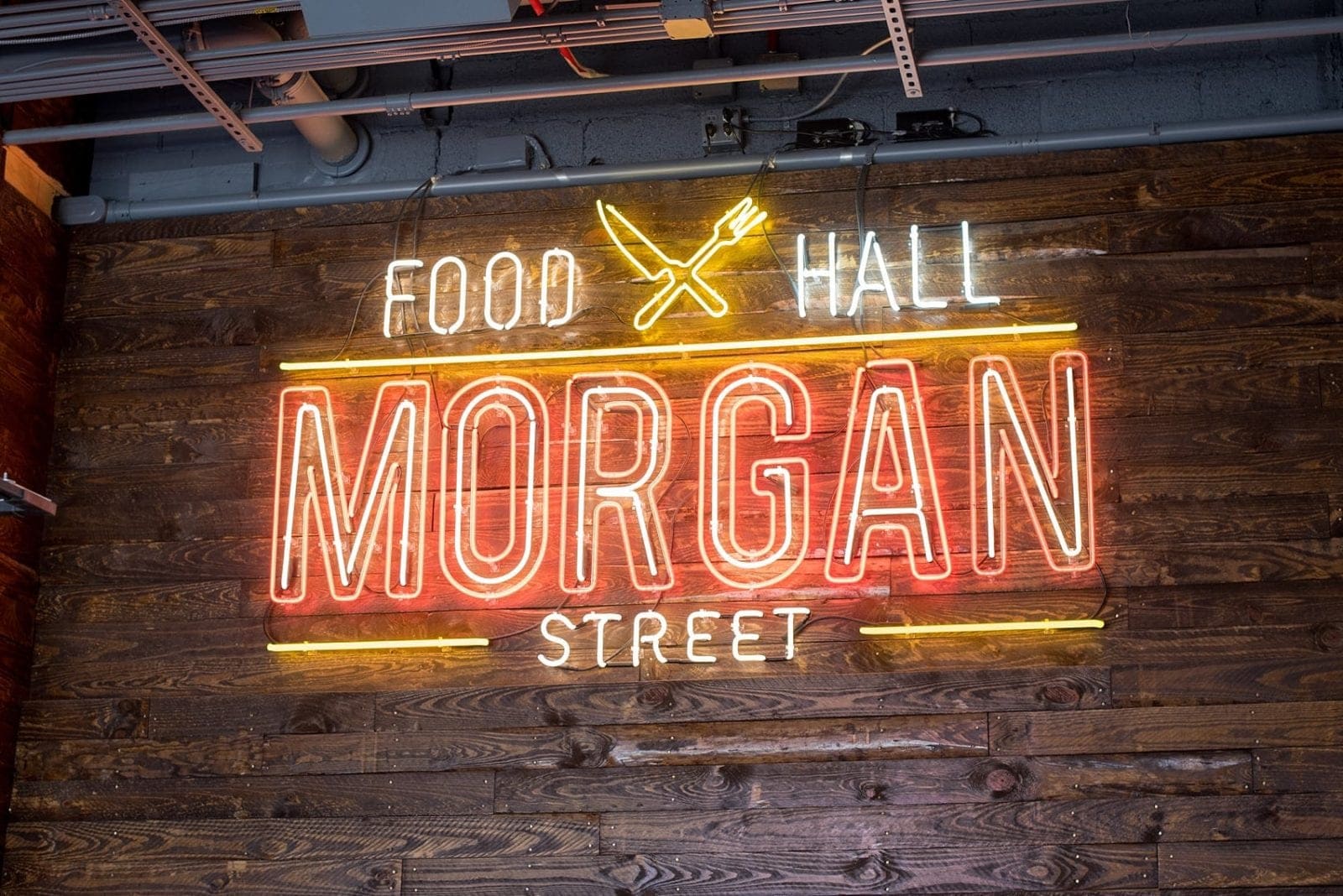 One of the best things to do in the capital of North Carolina is visit Morgan Street Food Hall in Raleigh! This downtown attraction has a ton of restaurant's food options and assorted shopping in the warehouse neighborhood. If you're moving soon or have been a long time resident there's something for everyone. Click through for photography and info on Sometimes Home! #sometimeshome #MorganStreetFoodHall #RaleighNC #downtownRaleigh #ThingstodoinRaleigh #RaleighNorthCarolina #DTRaleigh #FoodHalls