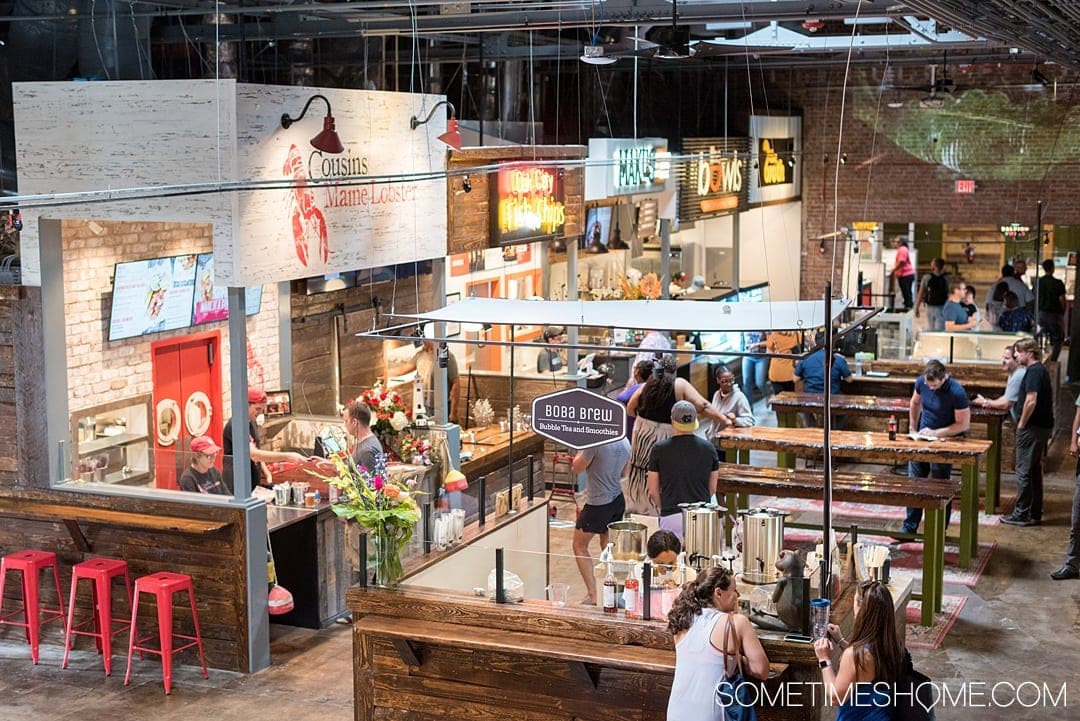 One of the best things to do in the capital of North Carolina is visit Morgan Street Food Hall in Raleigh! This downtown attraction has a ton of restaurant's food options and assorted shopping in the warehouse neighborhood. If you're moving soon or have been a long time resident there's something for everyone. Click through for photography and info on Sometimes Home! #sometimeshome #MorganStreetFoodHall #RaleighNC #downtownRaleigh #ThingstodoinRaleigh #RaleighNorthCarolina #DTRaleigh #FoodHalls