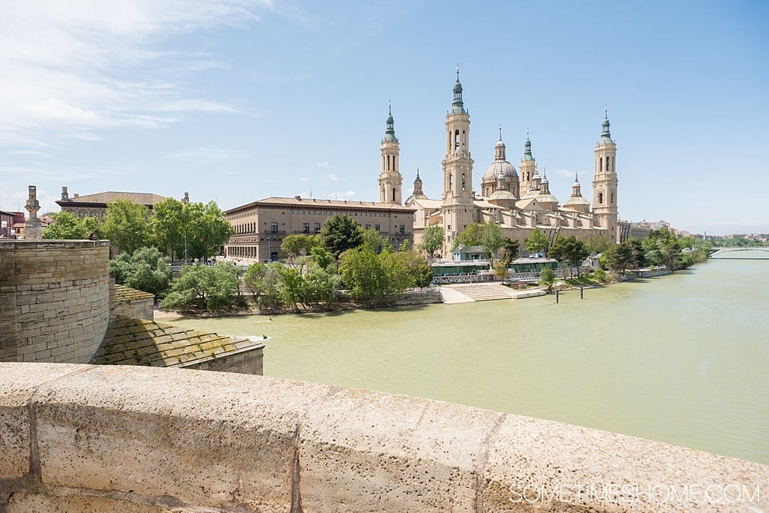 Day trip from Madrid to Zaragoza by train, in Spain, including things to do from sites and architecture, to food and street art! See amazing photography of this awesome city and gather ideas from Pilar Basilica to the moorish castle for your travel to Espana. #Zaragoza #SpainTourism #Spain #Espana #MadridDayTrip #Madrid #EbroRiver