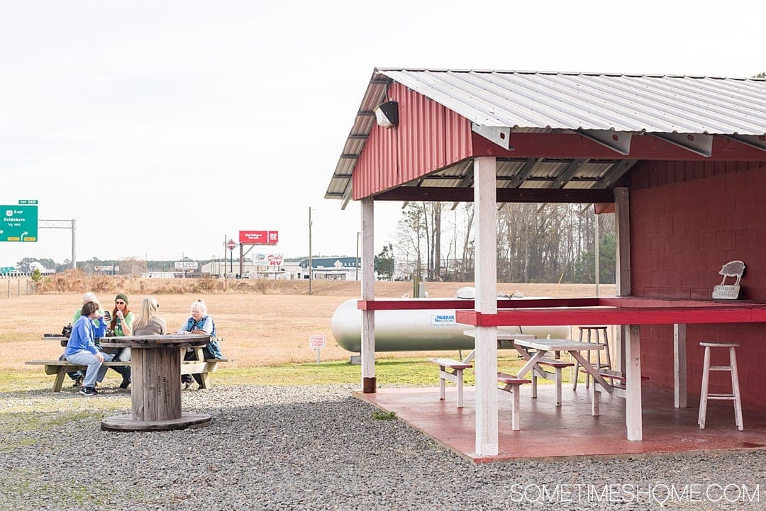 Goldsboro NC BBQ is a force to be reckoned with! The eastern vinegar based sauce of barbecue in this United States region can be sampled at a variety of restaurants, on pork, chicken, turkey or more. These restaurants have rubs to delight your taste too. Check out our article about the best places to try these southern delicacy recipes on delicious meats. #NCBBQ #barbecue #BBQ #northcarolina #GoldsboroNC #sometimeshome #vinegarBBQ #AdamsRoadside