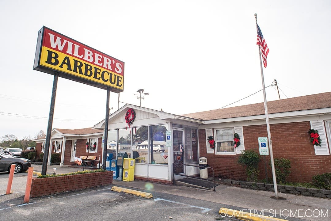 Goldsboro NC BBQ is a force to be reckoned with! The eastern vinegar based sauce of barbecue in this United States region can be sampled at a variety of restaurants, on pork, chicken, turkey or more. These restaurants have rubs to delight your taste too. Check out our article about the best places to try these southern delicacy recipes on delicious meats. #NCBBQ #barbecue #BBQ #northcarolina #GoldsboroNC #sometimeshome #vinegarBBQ #WilbersBBQ #Wilbers