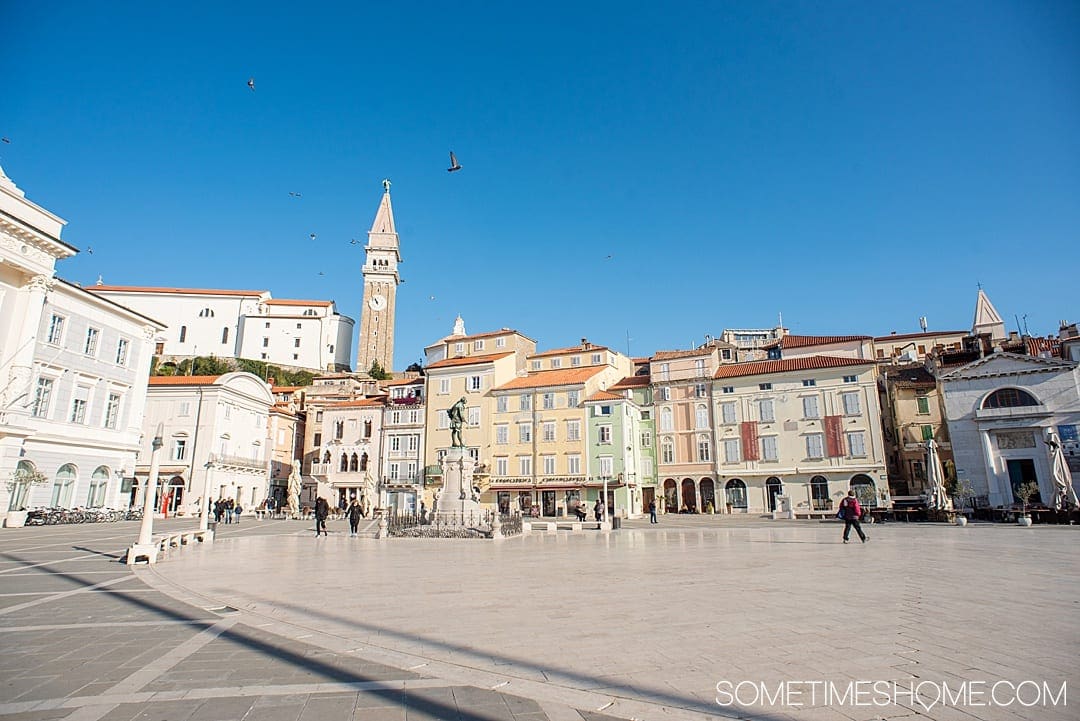 Travel to this city and read our our favorite things to do in Piran, Slovenia, a beautiful coastal town on the Adriatic Sea. You'll love watching the sunrise and sunset from the beach or your hotel, trying the food, its European squares and photography opportunities. #Sometimesome #Piran #Slovenia #AdriaticCoast #AdriaticSea