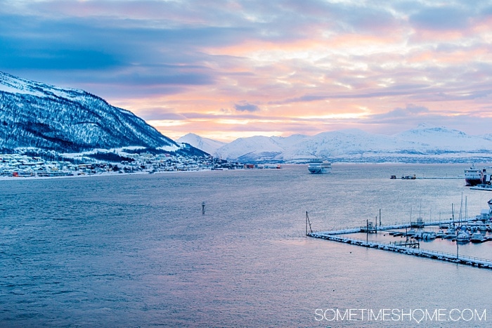 Tromso winter photos that will inspire you to travel to northern Norway during January or February. See bucket list things like Aurora Borealis (the Northern Lights), or participate in tours and things to do like feeding reindeer and taking a beautiful sleigh ride in the snow. #northernlights #sometimeshome #auroraborealis #reindeerfeeding #sleighride #tromsonorway #norway #tromsoinfebruary #tromsonorwayphotography