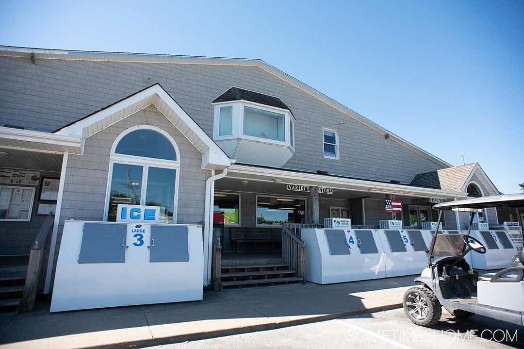 Gray and white building that is a grocery store on Ocracoke island in the Outer Banks, NC.