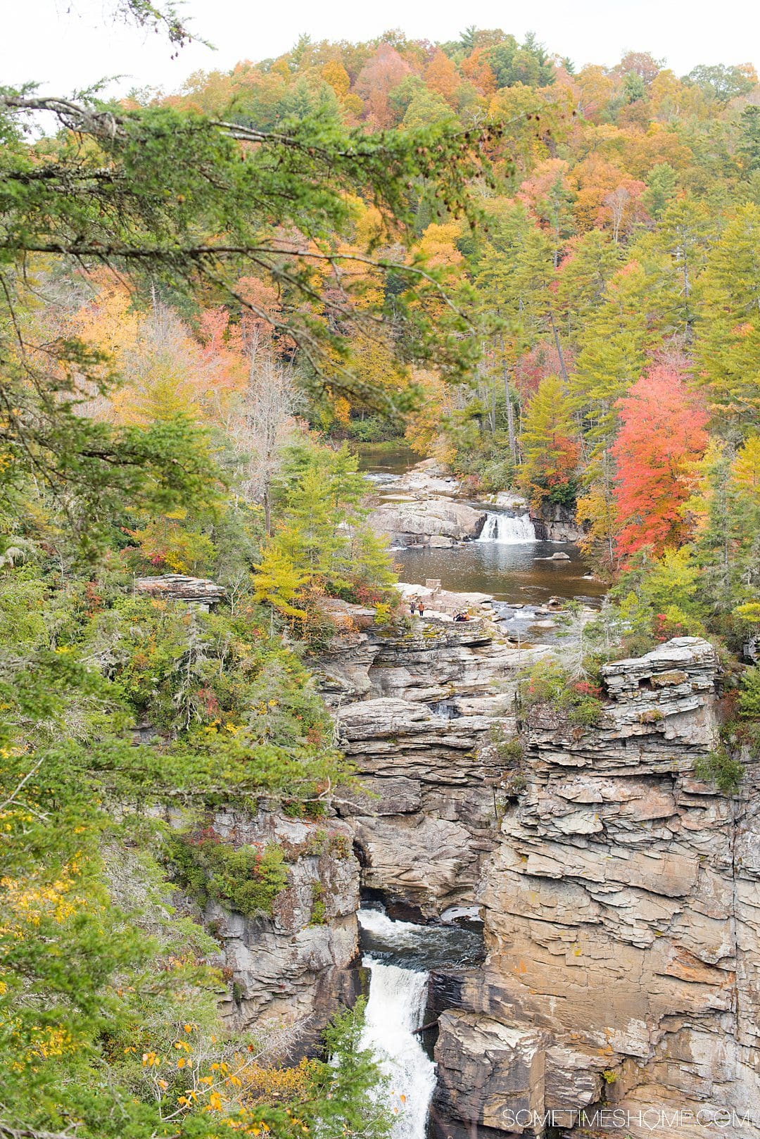 One of the best things to do in the North Carolina mountains is hike! We have your guide to the best hiking near Morganton, NC in Burke County near the Blue Ridge Mountains. Fall colors were at their peak in the Appalachian Mountains range at the time we took this beautiful photography at Linville Falls. #sometimeshome #besthikingnorthcarolina #autumncolors #peakfallleaves #blueridgemountains