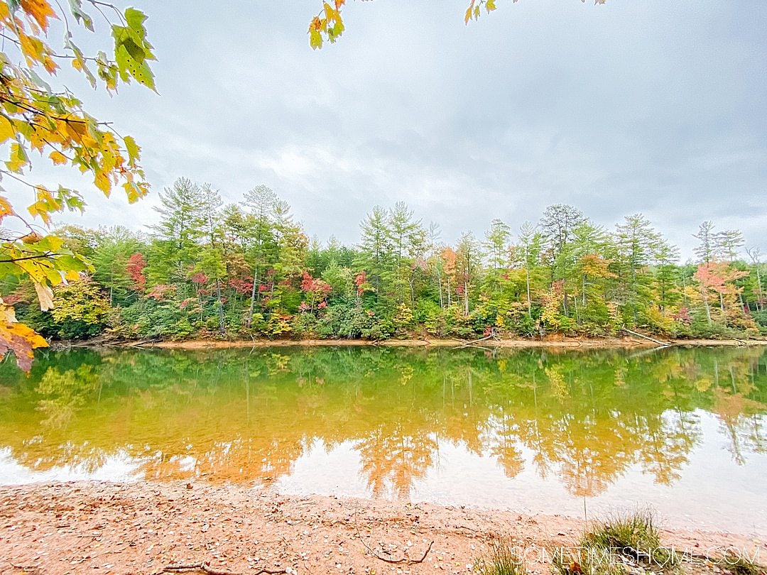 One of the best things to do in the North Carolina mountains is hike! And we have your guide to the best hiking near Morganton, NC in Burke County near the Blue Ridge Mountains. Fall colors were at their peak in the Appalachian Mountains range at the time we took this beautiful photography on Fonta Flora trail to Lake James. #sometimeshome #besthikingnorthcarolina #autumncolors #peakfallleaves #blueridgemountains