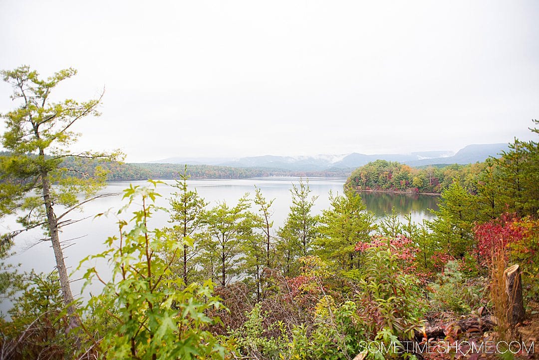 One of the best things to do in the North Carolina mountains is hike! And we have your guide to the best hiking near Morganton, NC in Burke County near the Blue Ridge Mountains. Fall colors were at their peak in the Appalachian Mountains range at the time we took this beautiful photography on Fonta Flora trail to Lake James. #sometimeshome #besthikingnorthcarolina #autumncolors #peakfallleaves #blueridgemountains