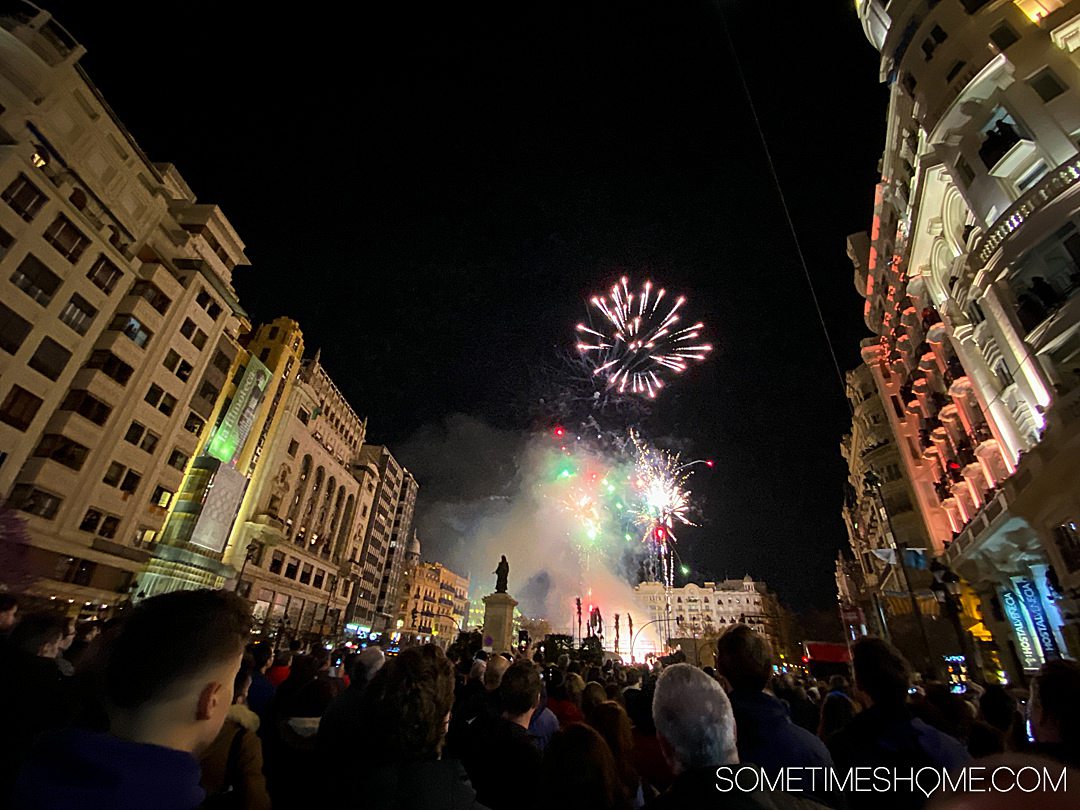 The city comes together to watch the Mascleta fireworks show in Valencia for Fallas one evening.