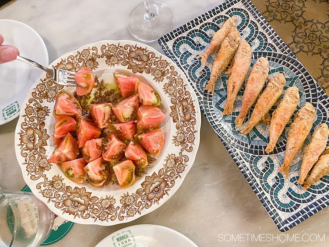 Sliced tomatoes and fried sardines in Barcelona