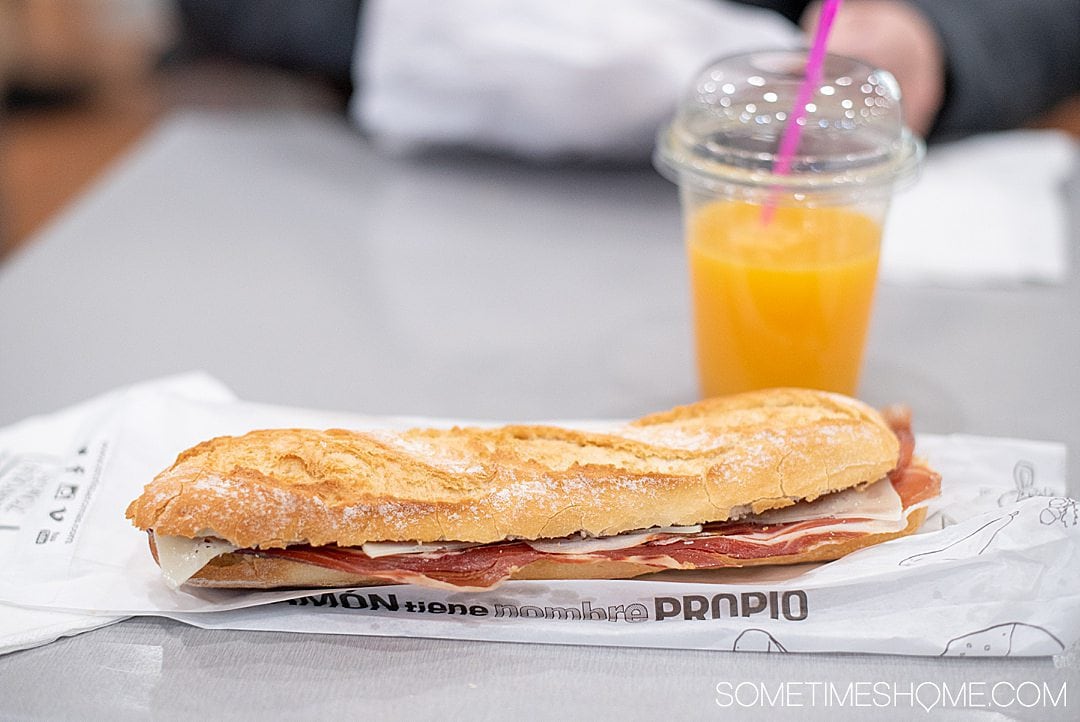 A ham and cheese baguette with fresh squeezed orange juice in Barcelona