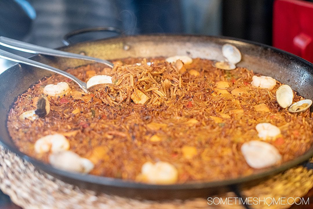 Fiduo noodles in a paella pan - must eat food in Barcelona