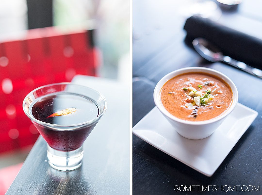 A red cocktail with wine and a tomato based soup