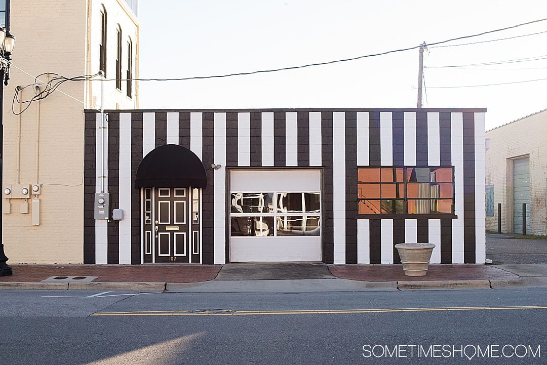 Vertical black and white striped facade of Goldsboro NC store